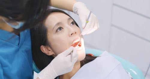 dentist examining patients teeth